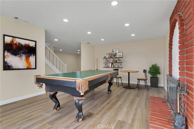 game room with light hardwood / wood-style flooring and billiards