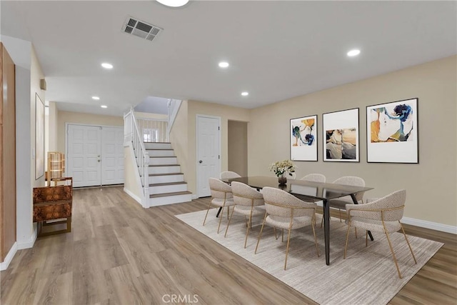 dining area with light hardwood / wood-style floors