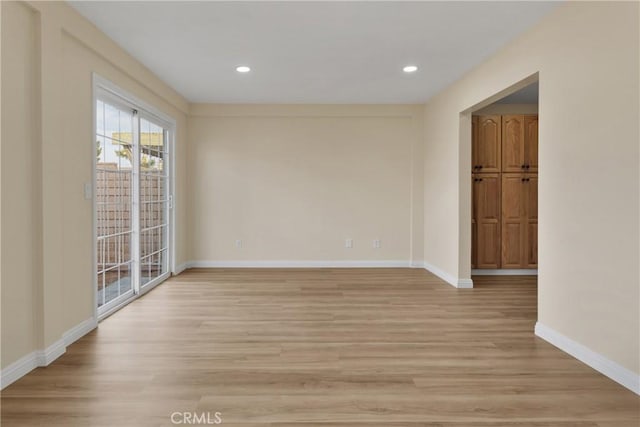 unfurnished room featuring light wood-type flooring