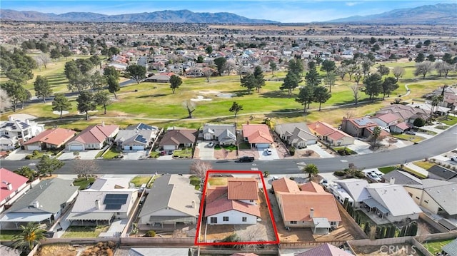 birds eye view of property with a mountain view