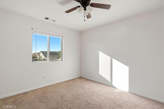 spare room with ceiling fan and carpet flooring