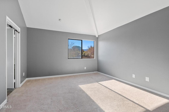 unfurnished bedroom featuring light carpet and lofted ceiling with beams