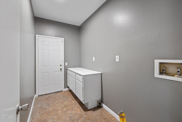 clothes washing area featuring cabinets and hookup for a washing machine