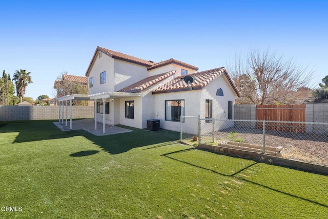 back of property with a patio area, central AC unit, and a lawn