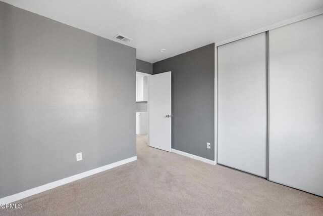 unfurnished bedroom with a closet