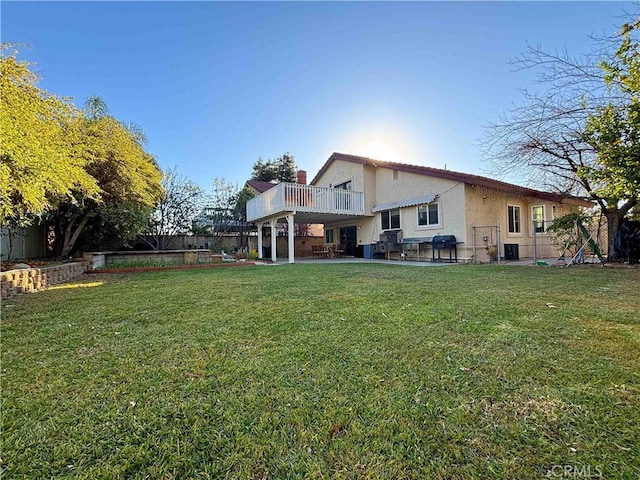 view of yard with central AC unit and a patio area