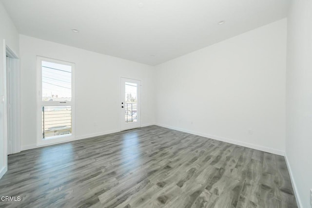 empty room with hardwood / wood-style flooring