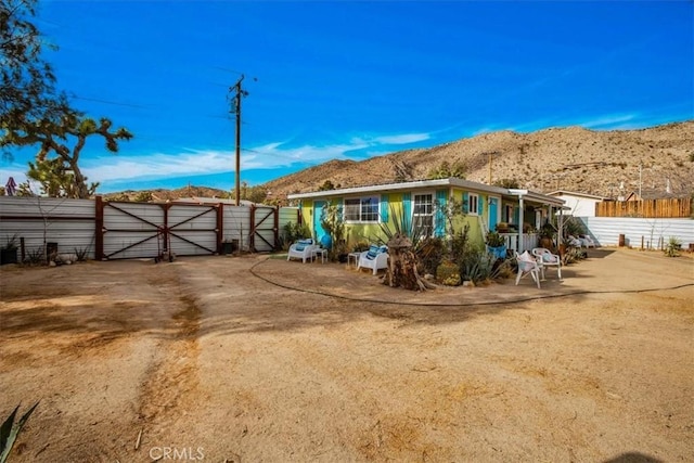 back of property with a mountain view