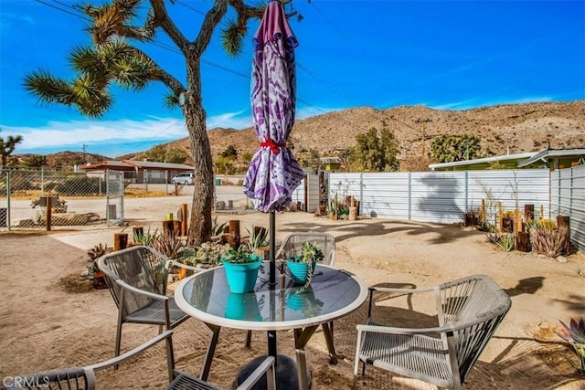 view of patio / terrace featuring a mountain view