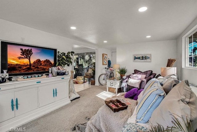 carpeted bedroom featuring multiple windows