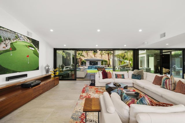 living room featuring a wall of windows