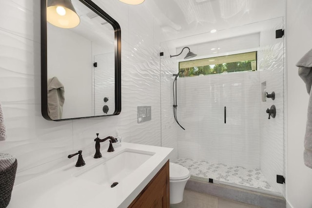 bathroom with toilet, a shower with shower door, backsplash, and vanity