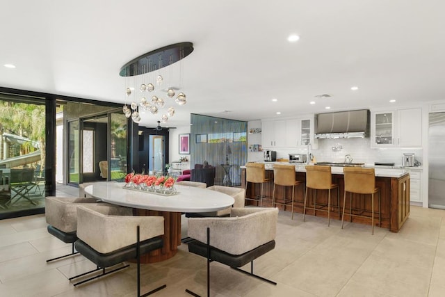 dining area with an inviting chandelier and floor to ceiling windows