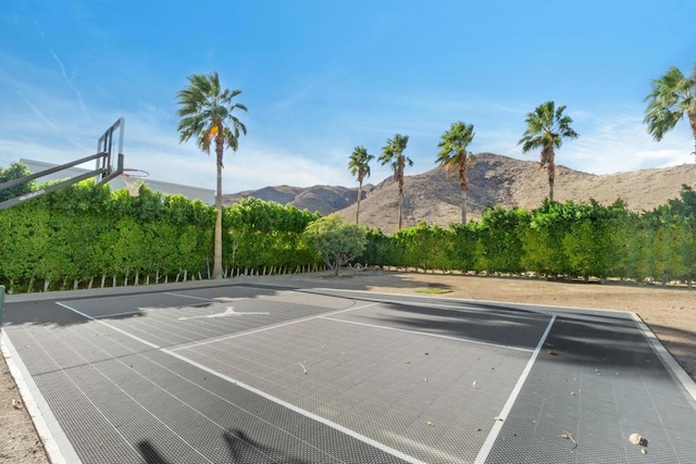 view of basketball court featuring a mountain view