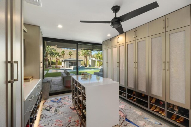 office area with ceiling fan and floor to ceiling windows