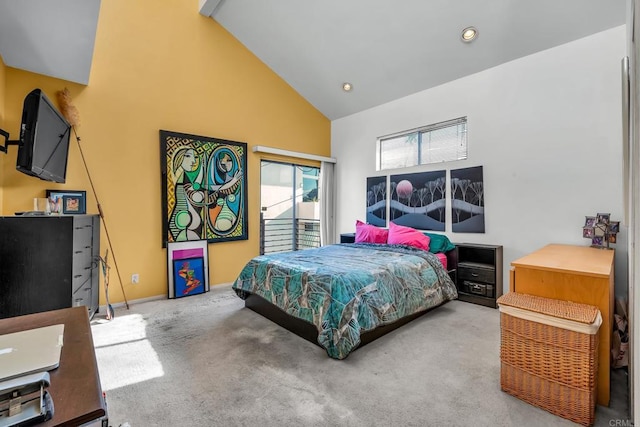 carpeted bedroom with high vaulted ceiling