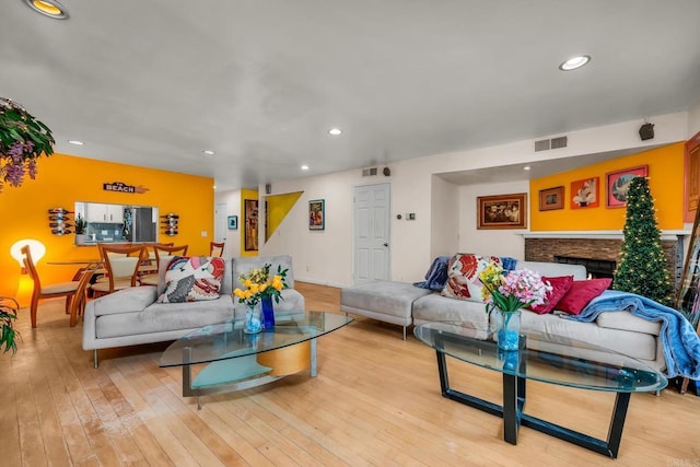 living room with light hardwood / wood-style flooring