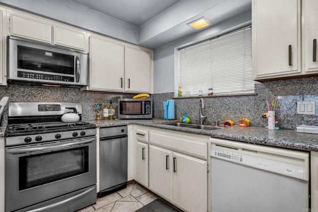 kitchen with sink, white cabinets, and stainless steel appliances