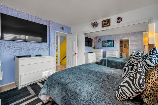 bedroom featuring a closet and connected bathroom