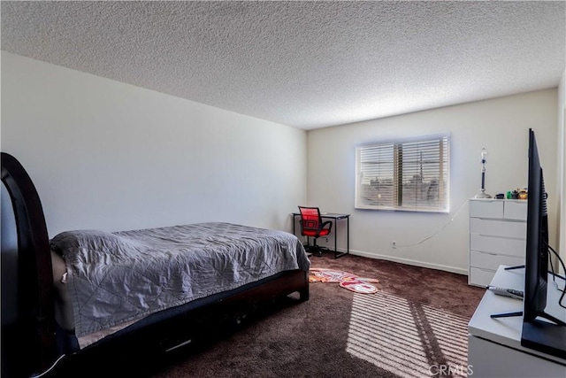 carpeted bedroom with a textured ceiling