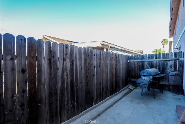 view of patio featuring a grill