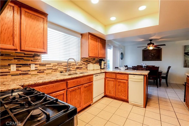 kitchen featuring range with gas cooktop, dishwasher, sink, kitchen peninsula, and ceiling fan