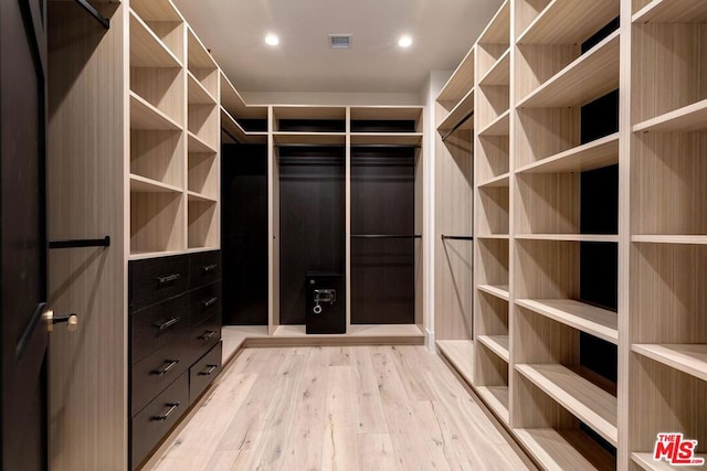 walk in closet featuring light hardwood / wood-style floors