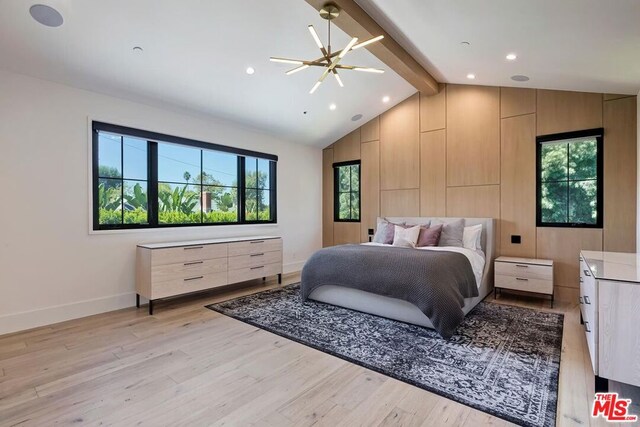 bedroom featuring light hardwood / wood-style flooring, a chandelier, and vaulted ceiling with beams