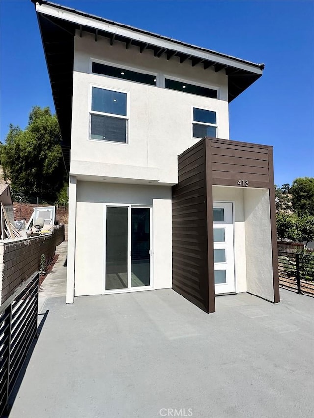 rear view of property with a patio