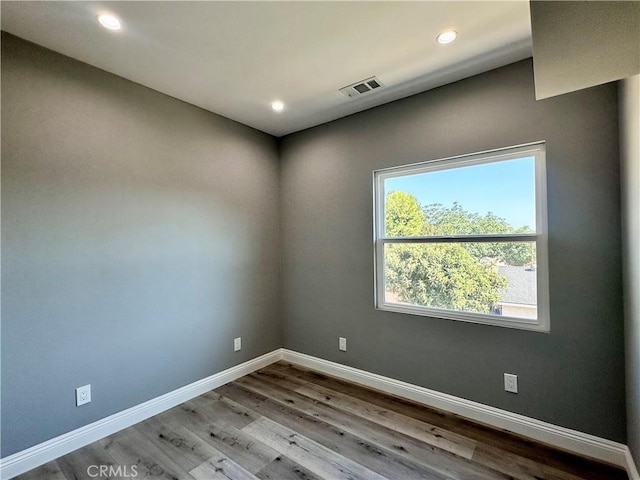 unfurnished room featuring light hardwood / wood-style flooring