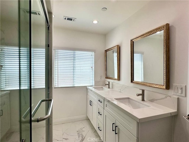 bathroom with an enclosed shower and vanity