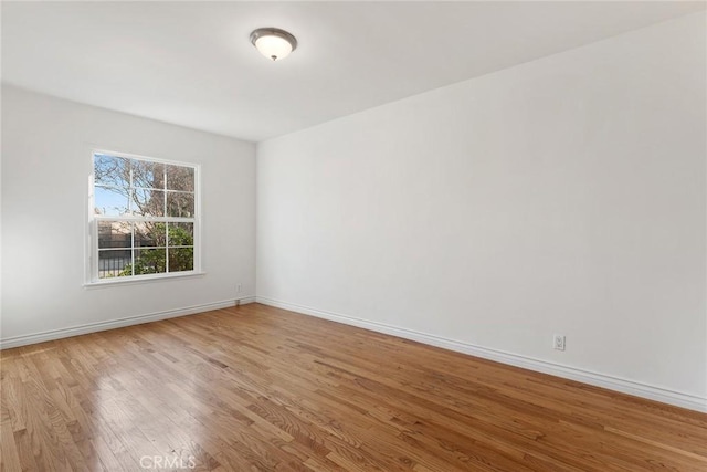 spare room featuring light wood-type flooring