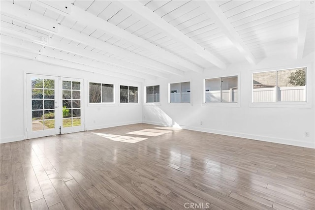 unfurnished sunroom with french doors and vaulted ceiling with beams