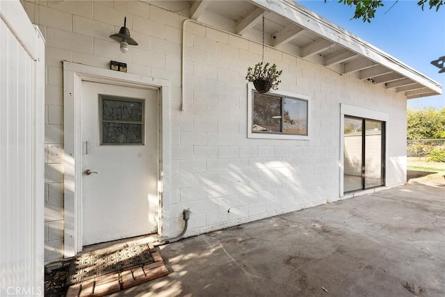 doorway to property featuring a patio area