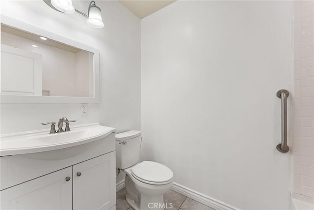 bathroom with toilet, tile patterned flooring, and vanity