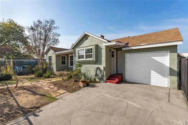 ranch-style home featuring a garage