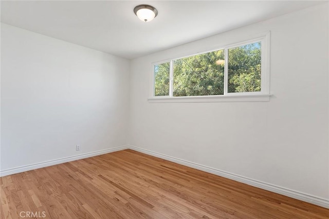 unfurnished room featuring light hardwood / wood-style flooring