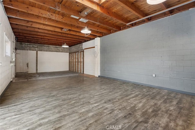 basement with wooden ceiling and hardwood / wood-style floors