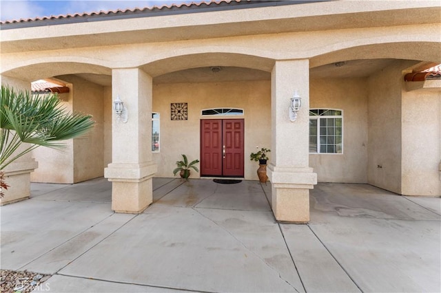 property entrance with a patio