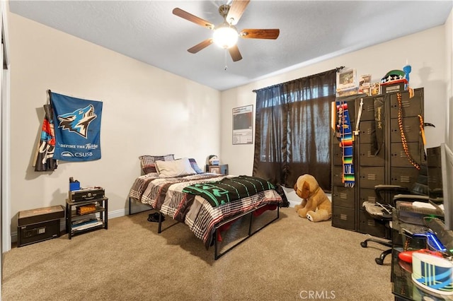 bedroom with ceiling fan and carpet flooring