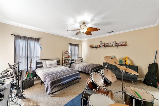 bedroom featuring ceiling fan, carpet, and ornamental molding