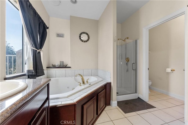 full bathroom featuring tile patterned floors, toilet, vanity, and independent shower and bath