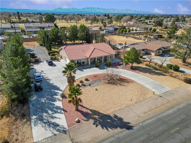 birds eye view of property featuring a mountain view