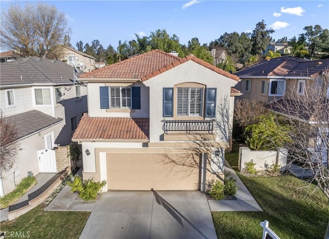 view of front of property featuring a garage and a front lawn