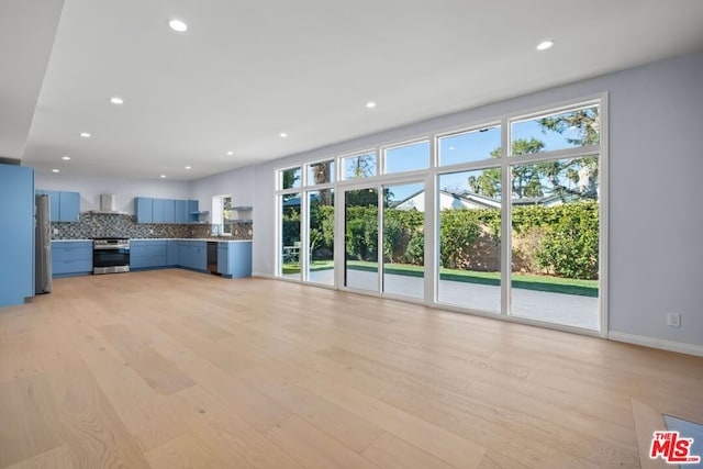 unfurnished living room with light wood-type flooring