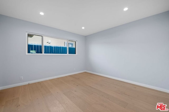 unfurnished room featuring light hardwood / wood-style floors