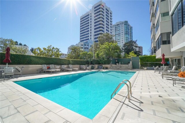 view of pool featuring a patio