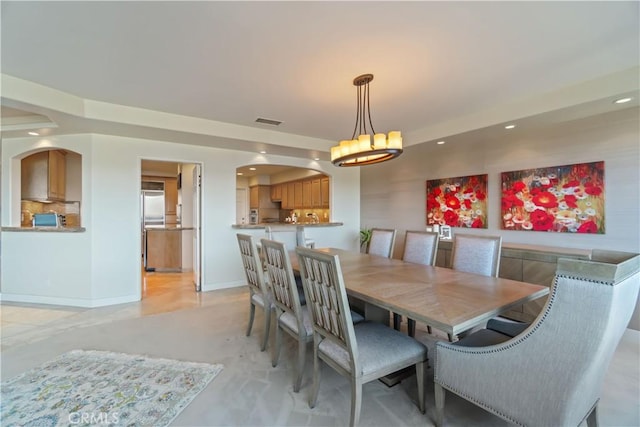 dining space featuring an inviting chandelier