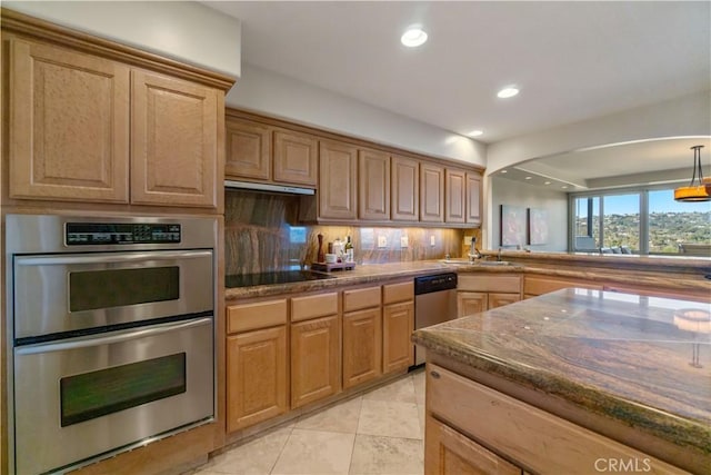 kitchen featuring stainless steel appliances, light tile patterned flooring, sink, and tasteful backsplash