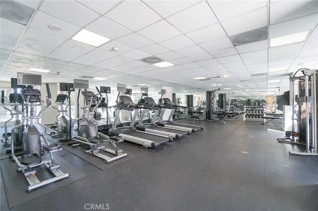 exercise room featuring a paneled ceiling